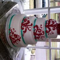 Round Wedding Cake Red Turquoise 6-8-10-12 rounds covered in fondant. Turquoise ribbon border and red buttercream piping. Red gumpaste roses. Love this color combination!