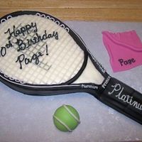 Tennis Racket Cake Carved from 1/4 sheet. Covered with MMF and black Satin Ice fondant. Buttercream details painted with Luck's silver airbrush color....