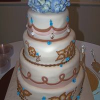 Ivory Fondant Wedding Cake 6-8-10-12 covered in ivory MMF. Fondant details and buttercream brush embroidery flowers. This was a combination of two cakes the bride...