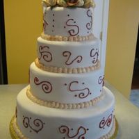 December.jpg This is a red velvet cake/raspberry buttercream filling. Gumpaste flowers and fondant.