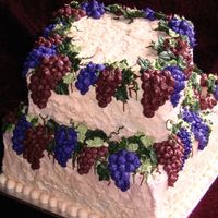 Tuscany Two tier square covered in buttercream, with vines, leaves and grapes.