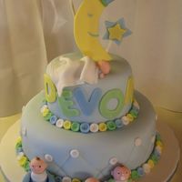 Baby Moon Star Fondant Cake with Fondant sculpted babies and details. The Baby's name, Devon, is on the front.