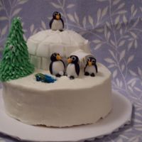 Penguin Winter Scene Cake that I made for a holiday party. Base is yellow cake with lemon filling and igloo is eggnog holiday confetti cake. Penguins and igloo...