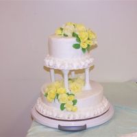 Wedding_Cake_Photos_002.jpg Another view.Bottom cake is white with black raspberry filling and top is chocolate with buttercream icing. I opted for the buttercream...