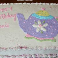 Teapot Birthday Buttercream frosting with transfer trace of invite. I added some colored sugar left over from a combo pack of sprinkles my nieces like,...