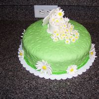 Pocket Full Of Daisies This is a white cake with lemon curd filling, a pomegranate glaze, with lemon buttercream crumb icing and a patterened fondant finish....