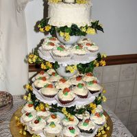 Cupcake Cake For my parents 60th Wedding Anniversary, used wilton seperator plates and white glass goblets to seperate. Added silk flowers to the edge...