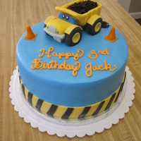 Dump Truck Construction Birthday Cake cake I made for a boy's birthday party. construction theme. truck and cones made from fondant. crushed oreo for dirt.