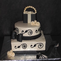 Black And Ivory Bridal Shower Cake this cake was made for a "shopping in New York" themed bridal shower. Buttercream frosting in ivory and black with fondant duff...