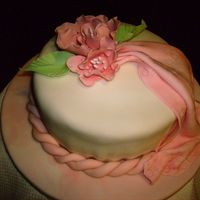 Brenda_012.jpg rolled fondant cake and drape with gumpaste flowers