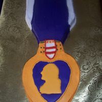 Purple Heart Medalion Lemon Coconut Cake with buttercream frosting. The heart with George Washington is a colorflow. This cake is for my Father-in-Law's...