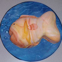 Fish Birthday Cake Gold fish birthday cake, covered and decorated with fondant. Cake board covered in fondant.