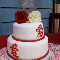 Asian Inspired Wedding Cake 2 tiered asian inspired wedding cake, covered and decorated with fondant