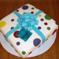 Polka Dot 1St Birthday Cake Girls 1st birthday cake with polka dots and a bow.