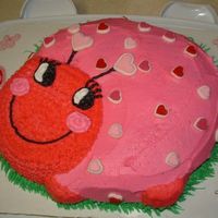 My Love Bug Strawberry cream cake and buttercream icing, with sugar decorations.