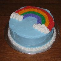 Rainbow Cake This is the first cake I've ever iced/decorated. It is for Wilton Course 1, class 2. I wish I had more time; I would have done a...