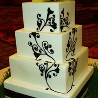Hand Painted Wedding Cake This was a cake for MY FIRST bridal show!!! WOOHOO! Go me:) The table scape was green and dark brown. I painted the design on 4 of the...