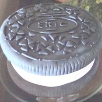 Eric's Oreo Cake This is an 8 inch cake and a 1O inch cake round, torted and split, covered in fondant and designed to look like an oreo. I used the logo to...
