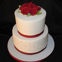 Red & White Wedding Small, simple wedding cake with roses and Diamond impression. Buttercream iced with ribbon.