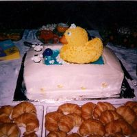 Rub-A-Dub White cake bath tub and duck. Knobs are made from large and small marshmallows. Spicket is childs bubble pipe upside down and a dowel rod...