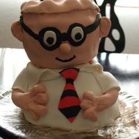 Dilbert Dilbert cake for my dad, poor thing is leaning. Chocolate cake with Fondand accents. All cake