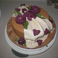 Gumpaste And Fondant Final my first fondant cake. I really need to get better at taking pictures!! Used used MMF to cover the cake. Couldn't do the wilton stuff...