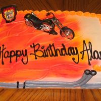 Motorcycle Cake 1/4 sheet chocolate cake w/ rasberry filling and whip topping. Thanks for looking.