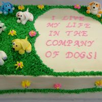 Dog Rescue Birthday Cake This cake was done for a woman who works for a dog rescue place. The puppies are fondant figures and the cake is buttercream iced and...