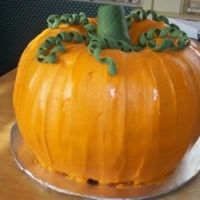 Pumpkin Cake The cake is pumpkin flavored (and pumpkin shaped, but I hope you can tell that much!!) with a delicious cream cheese icing. Accents are...