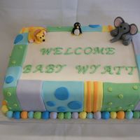 Zoo Shower Fondant covered cake, decorated with fondant "quilt squares" and fondant figure zoo animals. I decorated this cake to match the...