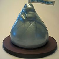 Hershey's Kiss Giant Hershey's Kiss carved out of 5 round layers. Flag is an edible image on gumpaste. TFL!