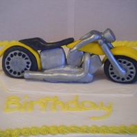 Motorcycle Cake Sheet cake with buttercreme icing. Motorcycle is MMF painted with metallic edible paint.