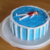 Mel In The Pool This cake is a replica of my MIL's pool. My daugher loves to swim and this is how she looks every weekend. LOL Complete with goggles...