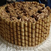 Chocolate Lovers Cake 3 chocolate cake mix with chocolate pudding,white chocolate bc filling with whipped chocolate mousse covered with dove bar candys and heath...