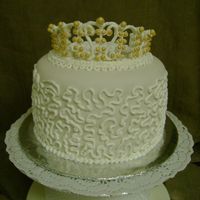 Bridal Shower Practice Cake White cake with amaretto sirop,cool whip/nutella filling,fondant,RI decorations and tiara.the fondant darkened a little because of the...