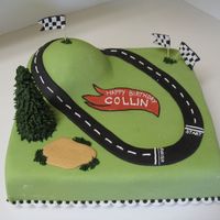 Racetrack Cake This cake was for a little boy who loves matchbox cars, and I think they put a few on the cake at the party.