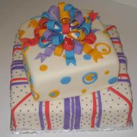 Present Cake This was my first time using gumpaste and doing a bow. Next time I don't think I'll use white "glue" for the bow, but...