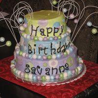 Savanna's Special Day Yellow butter cake and b/c. Fondant dots and balls. 20g wire. I left the top empty so they had a place to put the candles.