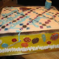 Quilting yellow butter cake, bc icing, chocolate buttons, needles, and scissors. spool of thread is a mashmallow covered in bc w/ chocolate top and...