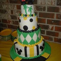 Jamaican And Disney Bridal Shower Cake 4in high layers 4,6,8,11. Buttercream with fondant accents. Base is covered in fondant to look like Jamaican flag. This is for a bridal...