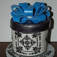 Shannon's 20Th Birthday 3 5x3 rounds, stencil, gumpaste bow and box top.Not exaclt how I planned for it to turn out, but I am happy considering it didn't take...