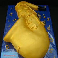 Saxophone Made from buttermilk cake and filled with SMBC strawberry flavor and chunks of white chocolate. The cakeboard was 12" x 16", so...