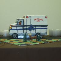 P9060259.jpg This was for my brothers grooms cake. He wanted to incorporate 3 themes into his grooms cake, an ambulance, hunting, and Dallas cowboys....