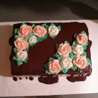 Mom's Bday Cake My first attemot at ganache....it was lots of fun. Yellow cake with butter cream frosting and roses.