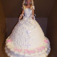 Barbie 1St Communion Cake Barbie doll in cake with rosary beads for 1st communion, yellow cake with buttercream icing