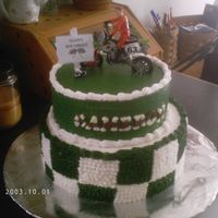 Dirt Bike Cake This is a cake I made for my nephews birthday. I had a hard time getting the checkered board even. My nephew loved it anyway. Thanks to the...