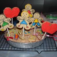 School Cookies i got the idea out of the wilton book. i just changed it alittle bit. i added #s and rice krispies to hold the sticks in place :)