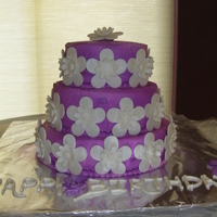 Hana's Cake My daughter wanted a purple cake for her 11th b-day. I got the idea from a Wilton yearbook. The cake was extra easy becasue I used purple...