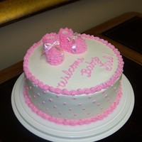 Baby Booties Baby Shower Buttercream iced. Booties formed from marshmallows, piped over with buttercream.