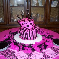 Pink And Black Whimsy Birthday Cake Iced in buttercream with fondant accents. "3" and "0" are sparklers.